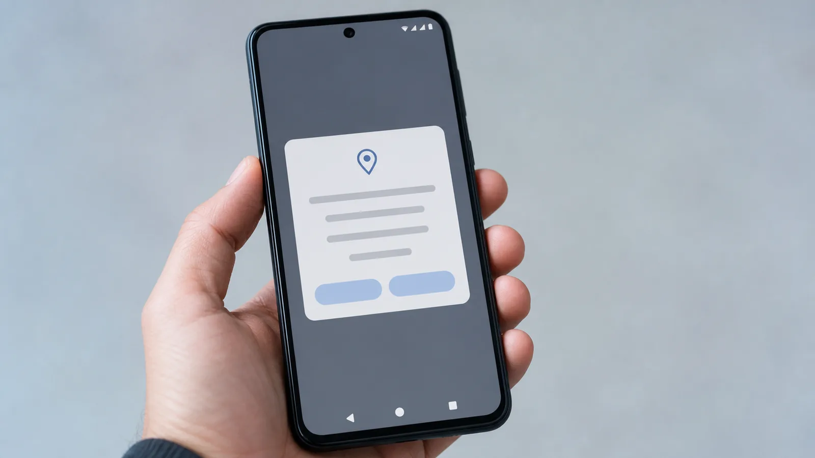 Hand holding an Android phone showing a system permission dialog with placeholder text and two buttons
